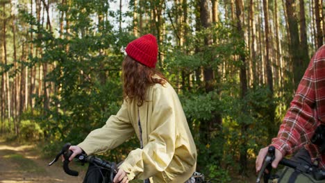 couple cycling in the forest