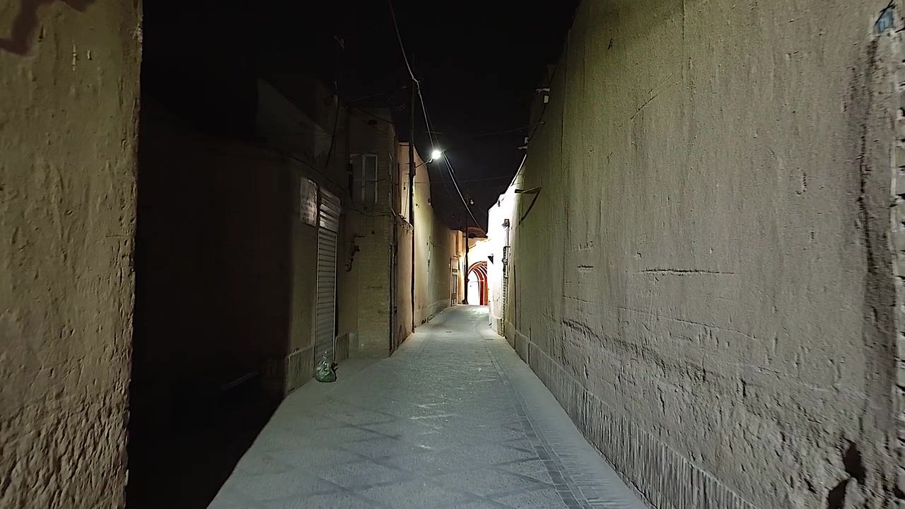 Narrow Alleyway in Historic City at Night