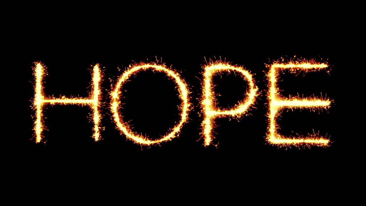 Hope text sparkler writing with glitter sparks particles firework on black 4k loop background