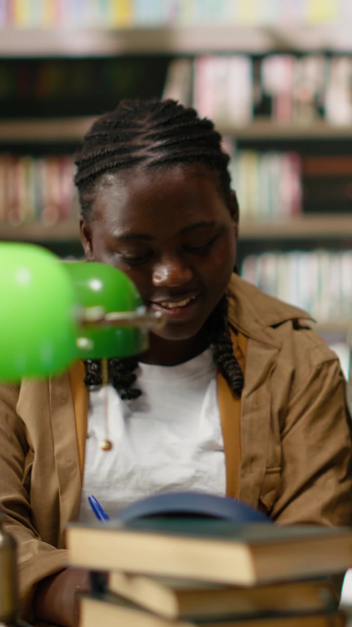 Vertical Video Students Happily Discussing Study Materials And Reading From Textbooks