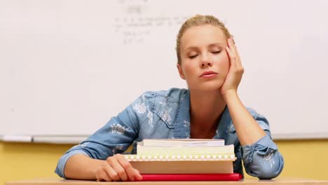 bored student looking at camera in classroom