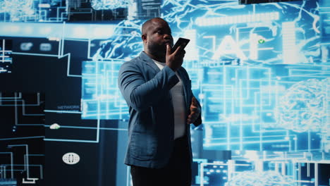 african american it specialist calling a technician on his smartphone
