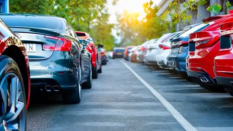 a row of red cars parked in a parking lot