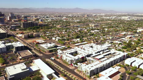 Aerial-circling-shot-of-apartment-buildings-in-sunny-day