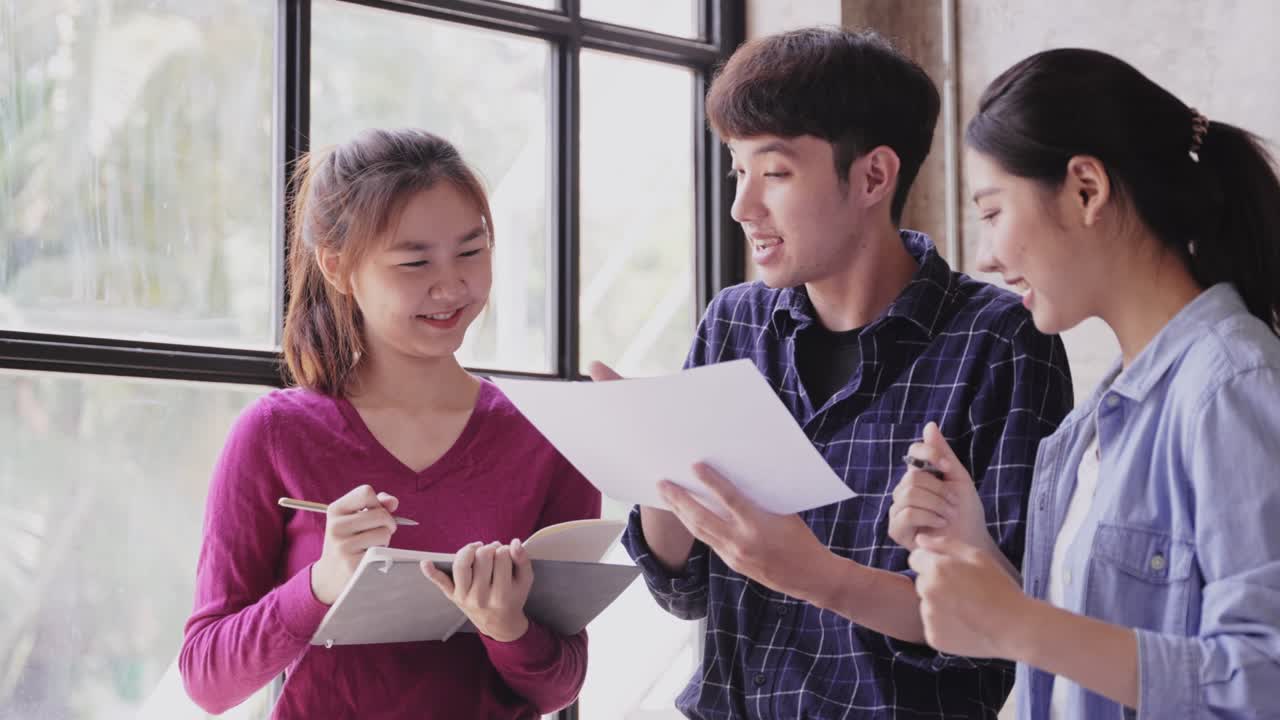 asian women Discussing budget plans, reports, chart concepts, graphs, paperwork data on laptop, tablet, at desk, office table. tax credit career consultant stock broker or market