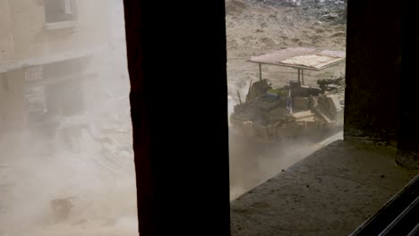 Looking-out-through-house-window-of-the-Israeli-battlefield-vehicle-Merkava-Mark-IV-Barak-tank-on-the-streets-during-the-Israel-Hamas-war-conflict