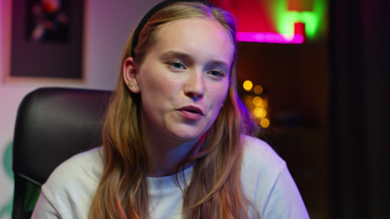 Young woman gamer smiling at the camera