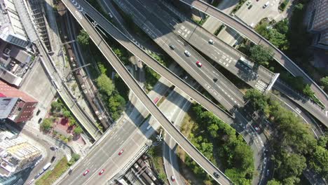 Massive-Highway-interchange-with-traffic-on-all-levels-in-downtown-Hong-Kong,-Aerial-view