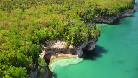 aerial of coastline at pictured rocks national lakeshore, michigan - indian drum rock formation