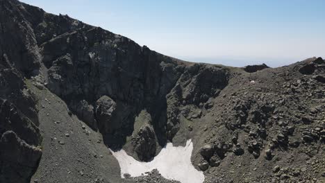 Drone-view-of-snow-ruins-in-the-high-mountains-of-the-Black-Sea,-view-from-the-top-of-the-mountains