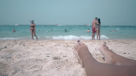 couple in love embraces and comes into turquoise ocean