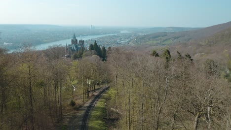 Drone---Aerial-shot-of-the-Drachenfelsbahn-train-of-Drachenfels,-castle-Drachenburg-and-the-river-rhine-Siebengebirge-near-Bonn---Königswinter-25p