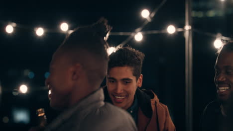 young-group-of-multiracial-friends-having-fun-african-american-man-dancing-enjoying-rooftop-party-at-night-laughing-celebrating-friendship