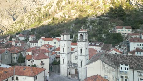 drone panning shot over the roofs of houses in the city kotor with a great view on the st tryphon cathedral and the adriatic sea