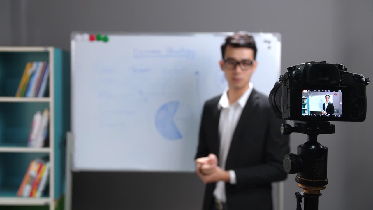 Asian Business Coach Recording Video At Home