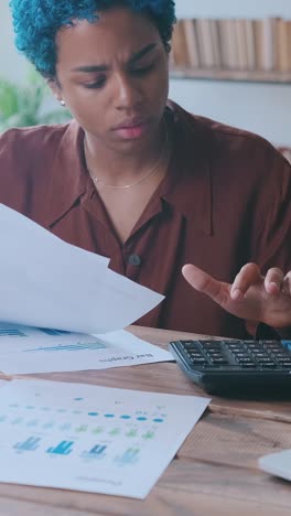 young tired focused african american woman financier conducting economic audit