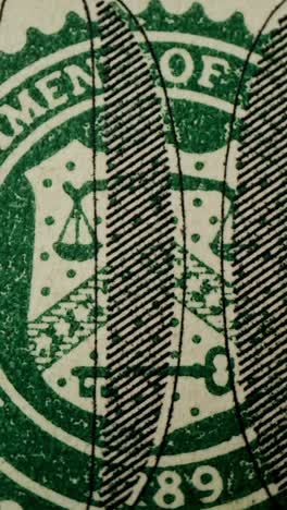 close-up of us dollar bill seal