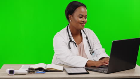 Female-doctor,-laptop-and-typing-by-green-screen