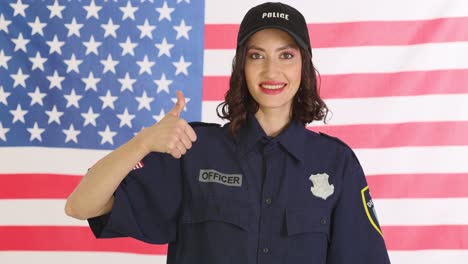 smiling police officer with american flag background
