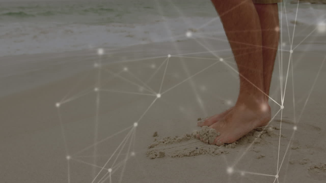 해변에 서 있는 남자의 낮은 부분에 대한 연결 네트워크