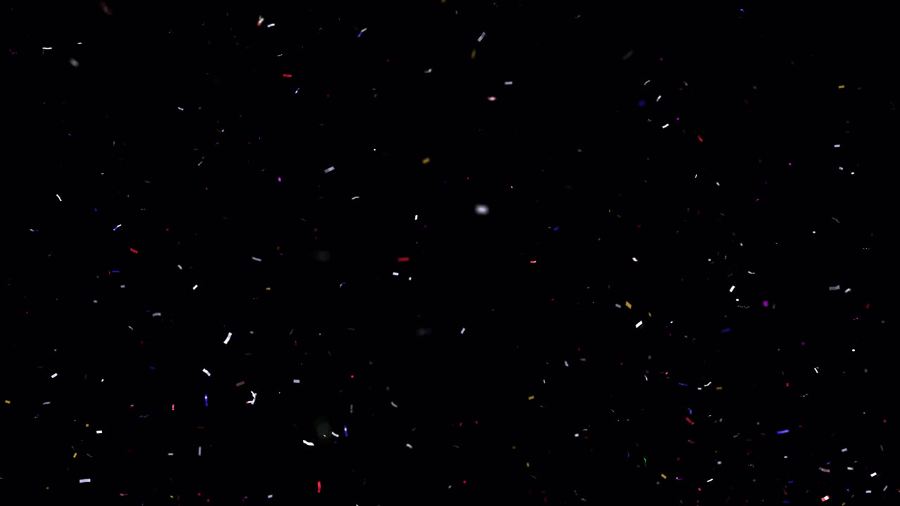 Confetti colorati e stelle filanti che esplodono e cadono su sfondo nero