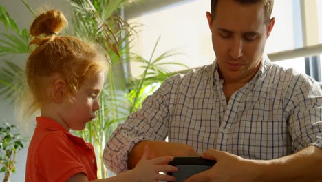 father putting mobile phone inside virtual reality headset 4k