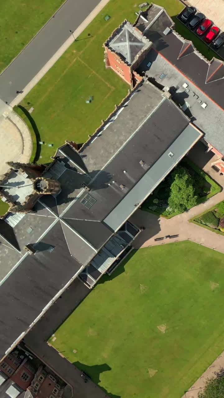 Overhead social ratio aerial video of Queen's University, Belfast on a bright and sunny day. Filmed in 1080x1920, 60fps and with Rec709 color