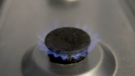 real gas burner on used cooker hob illustrating to turn the gas down to avoid waste