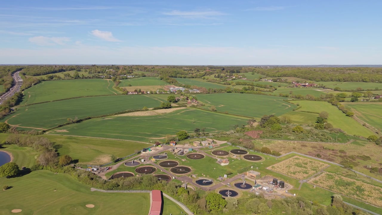 Expansive Aerial View of a Water Treatment Plant and Golf Course