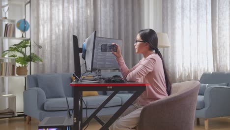 woman working from home on computer and mobile phone