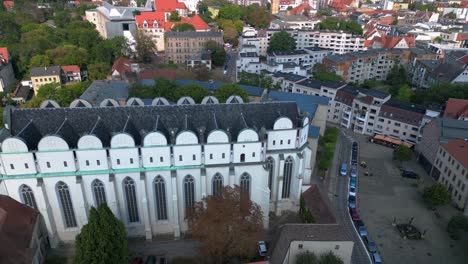 dome to halle in the city in germany is shining on a sunny summer day. fabulous aerial view flight fly reverse drone