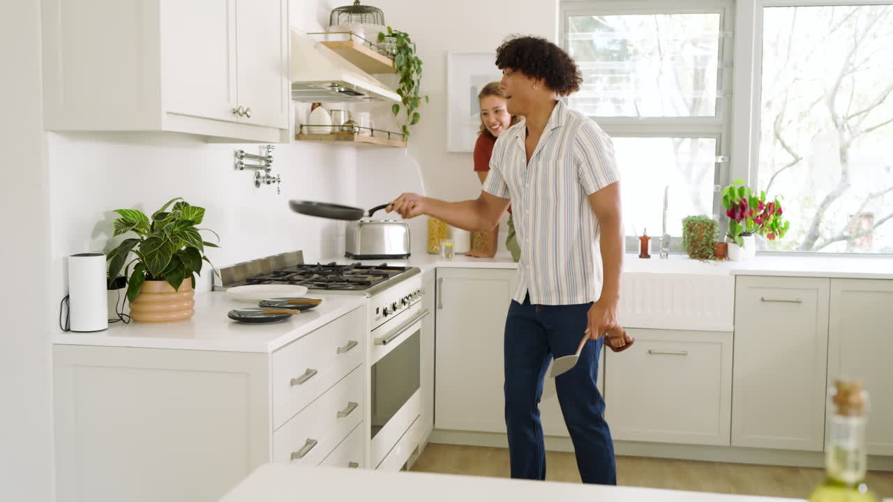 Young diverse couple cooking together in modern kitchen, enjoying quality time at home