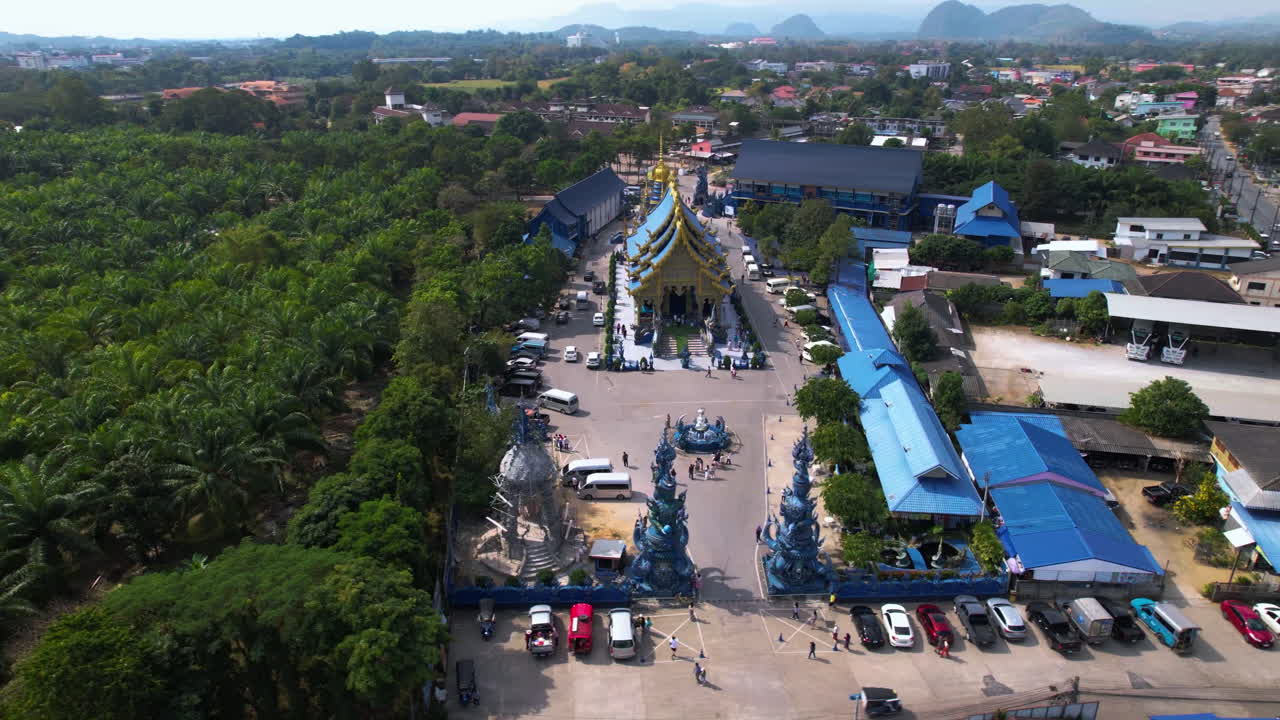 Aerial orbit shot in front of the Temple of the Dancing Tiger in sunny Chiang Rai