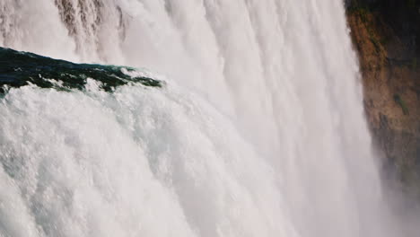 a powerful stream of water from niagara falls amazing nature on the border of the usa and canada