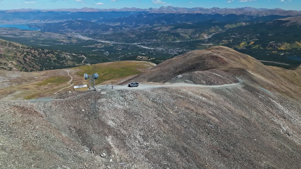 Aerial View of Mountain Peak with Vehicle and Communication Tower