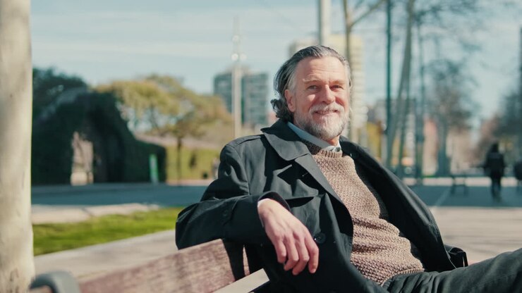 Happy Senior Man Smiling in the Park