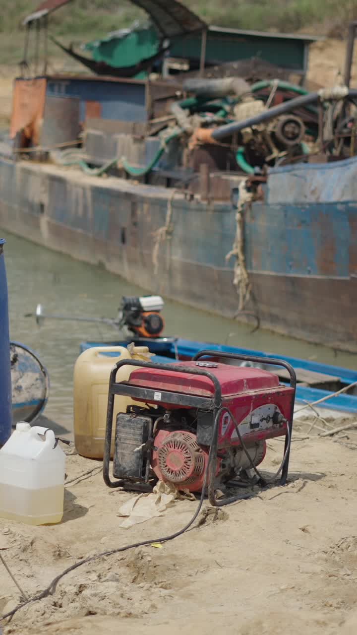 Generator and boat on sandy shore