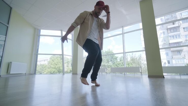 Man Breakdancing in Modern Studio