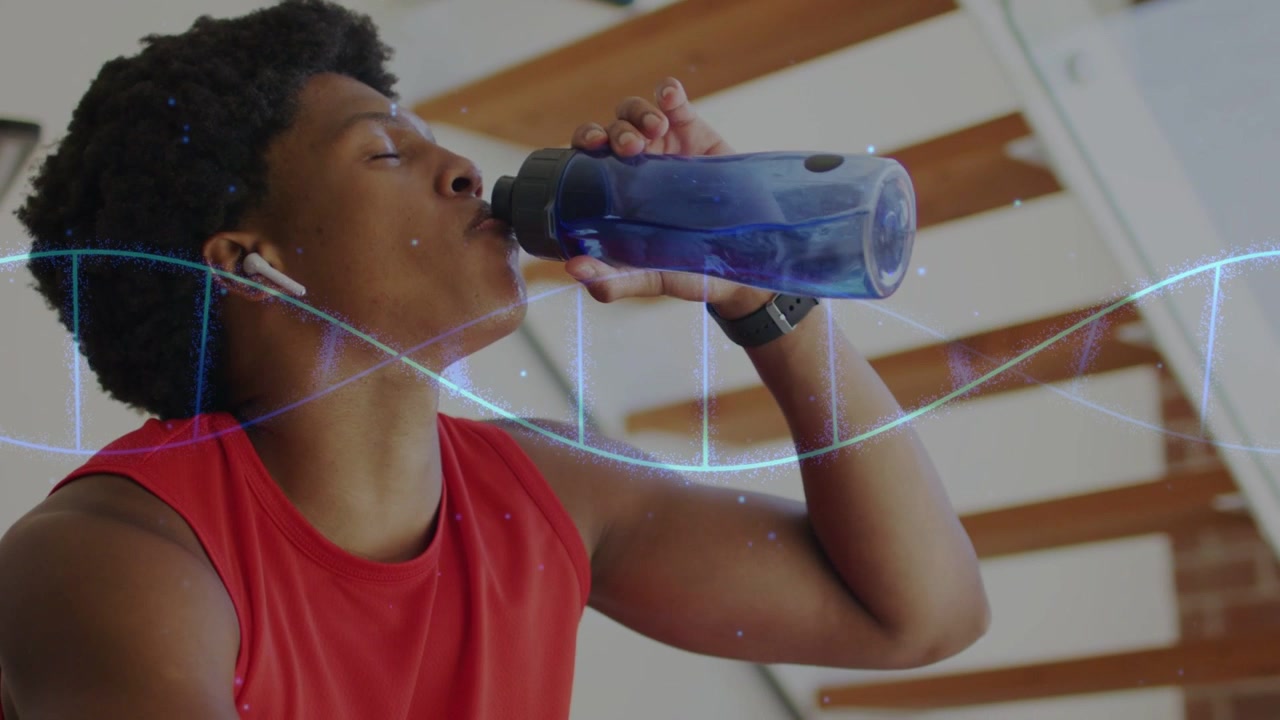 Man sipping blue bottle after workout set, breathing and leaning while helix sweeping across frame