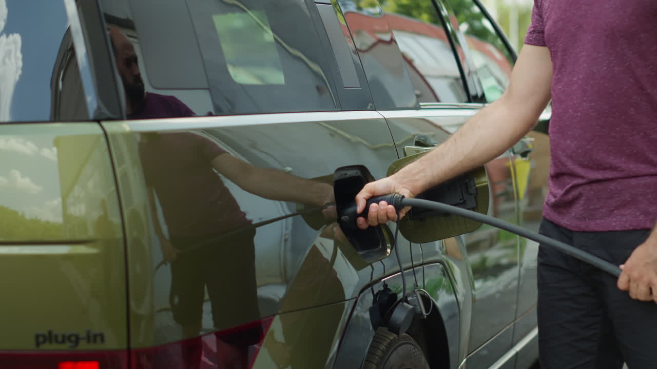 Driver Leaving Electric Suv Car Plugged Into Charger While Going To Work