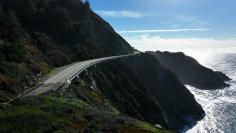 cinematic reveal of rock creek bridge highway 1 along pacific coast, california