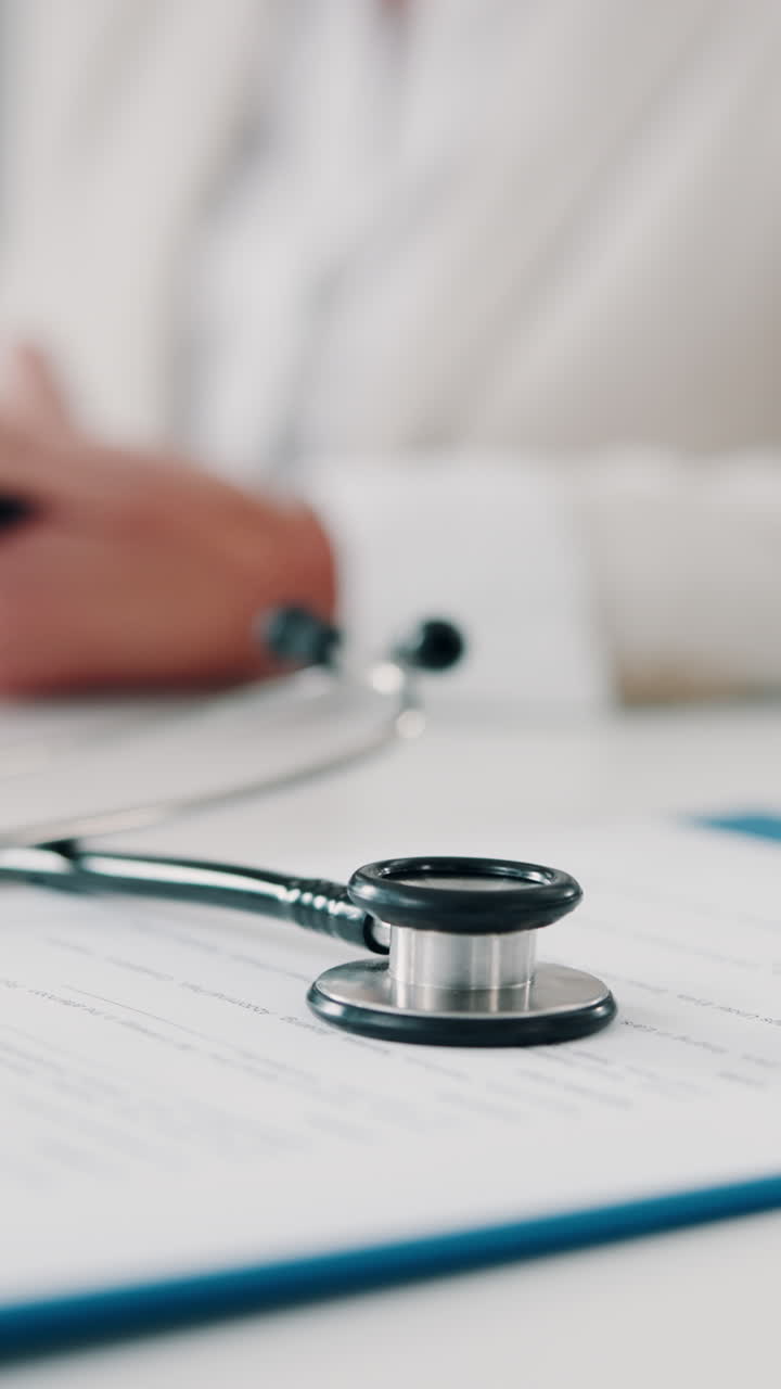 Stethoscope Resting on Medical Document with Doctor in Background