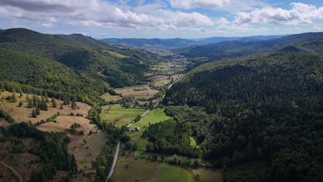 stunning aerial drone footage of poiana micului, suceava, showcasing green valleys and forests surrounded by hills