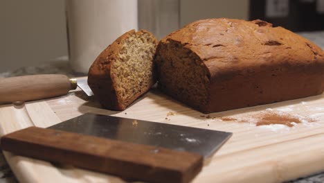 fresh loaf of sliced homemade banana bread with left to right slide