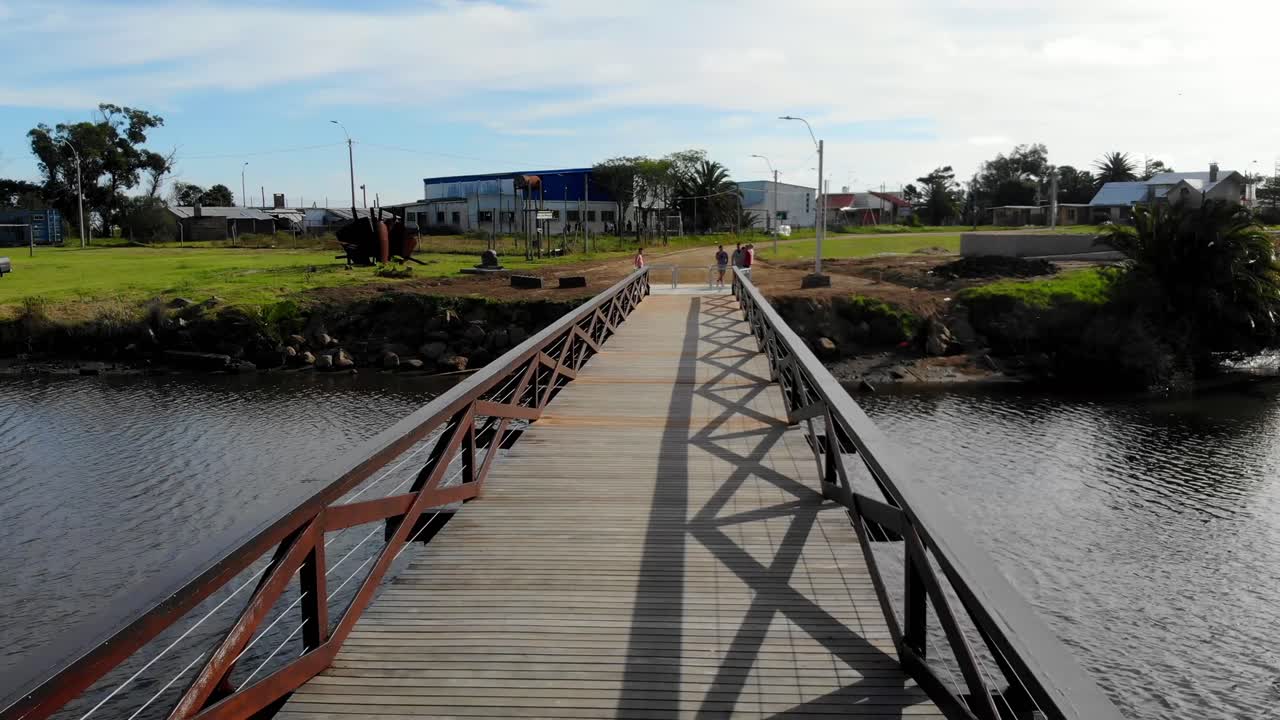 Aerial video of a bridge over a stream