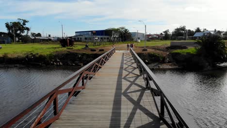 aerial video of a bridge over a stream