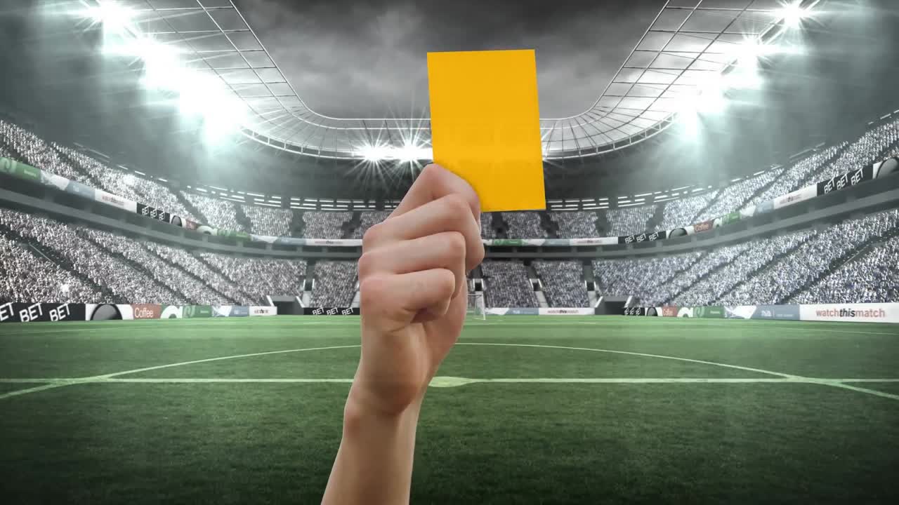 Animation of hand holding yellow card over stadium