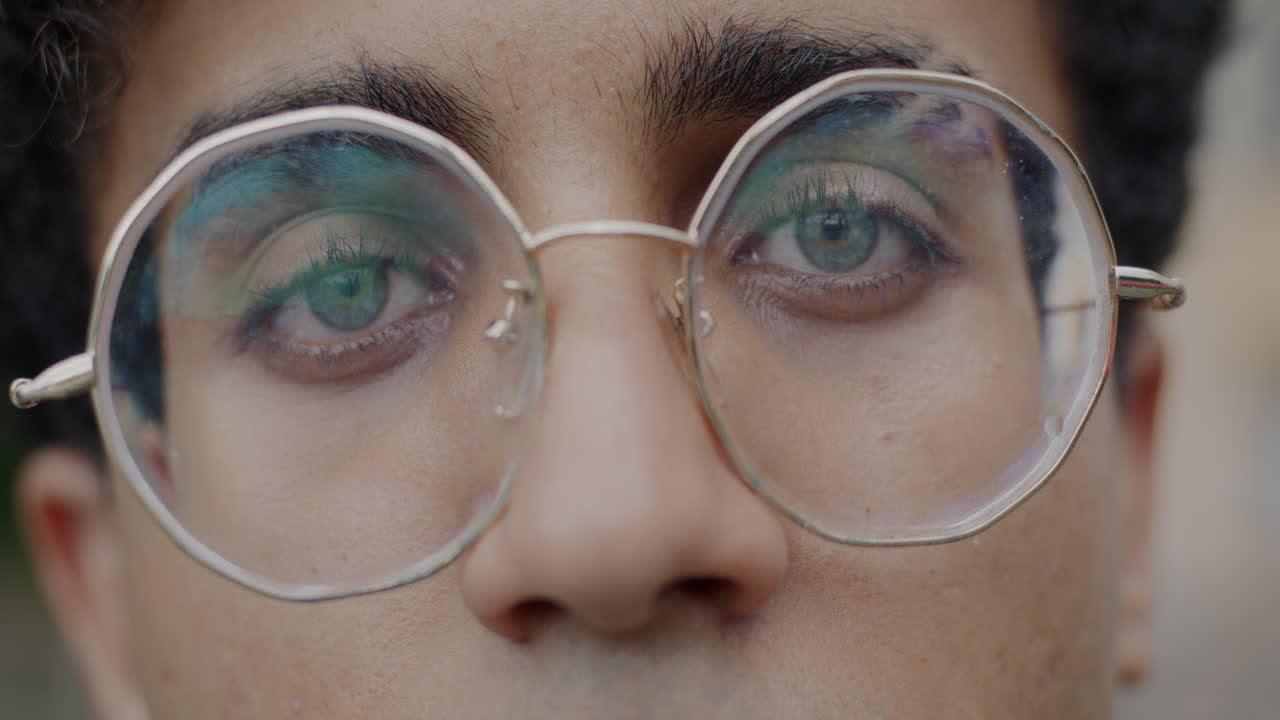 Close-up of a person wearing round glasses