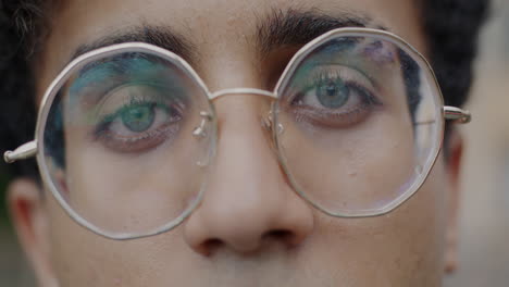 close-up of a person wearing round glasses