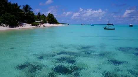 Low-angle-shot-of-tropical-Mexican-water-alongside-beautiful-white-beach